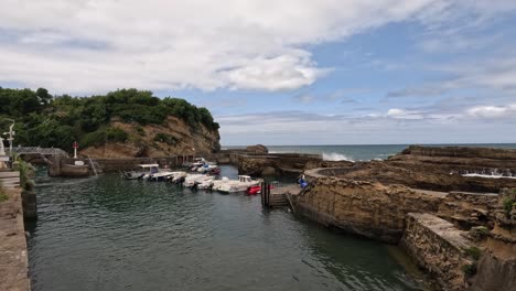 small private boats enjoy protection of concrete sea wall at biarritz