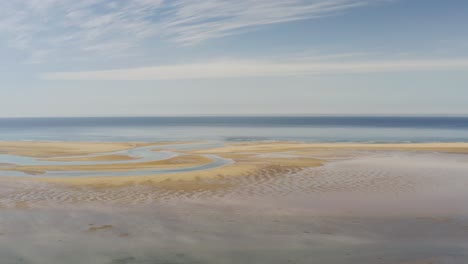 serene view of raudasandur red sands beach in westfjords of iceland