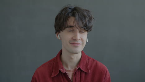 young man wearing earbuds