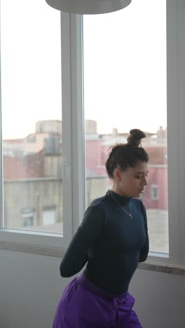 yoga pose by a window