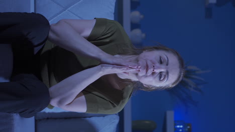 Vertical-video-of-Depressed-woman-covering-her-face-with-her-hand.