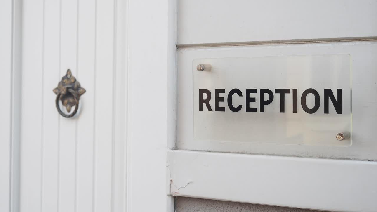 Reception Sign on a White Door