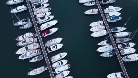 Aerial-top-down-shot-showing-luxury-boats-and-Yacht-parking-at-Novigrad-Marina-during-sunset-time