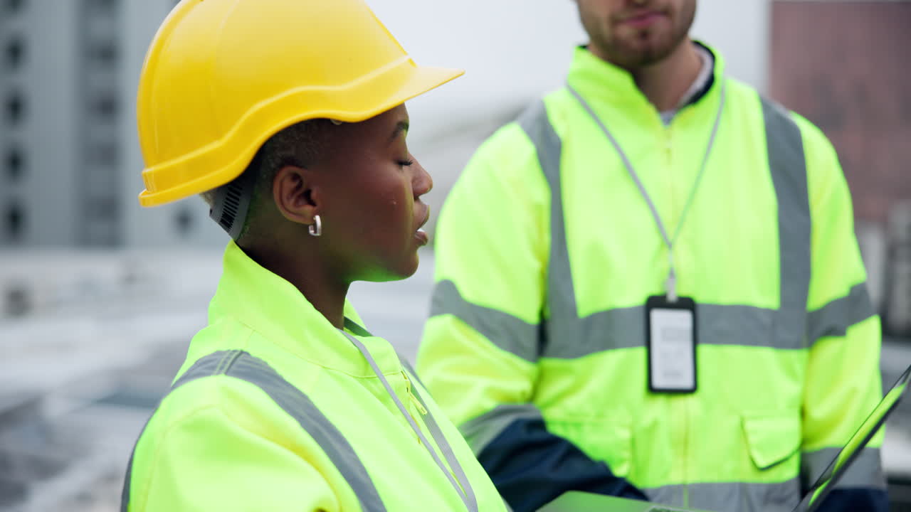 Construction Workers Discussing Project on Site