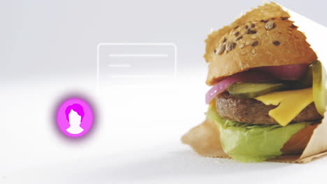 burger with lettuce and cheese next to glowing profile icon animation