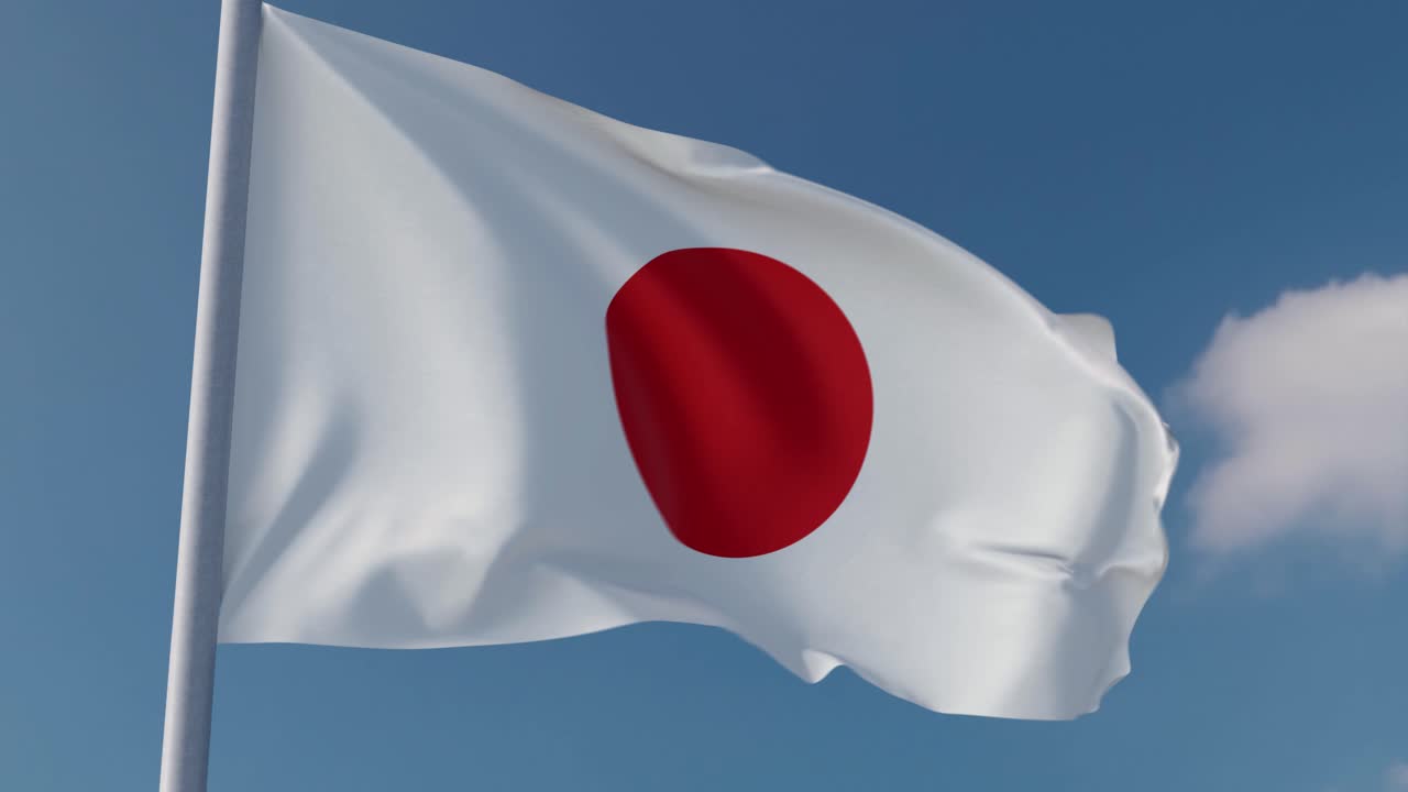 bandera nacional japonesa ondeando en el viento con un fondo de cielo azul