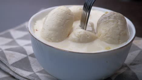 close up of indian sweet in a bowl on table.