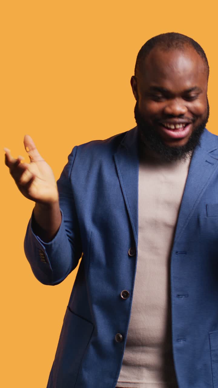 Happy African American Man Clapping Hands and Smiling in Studio