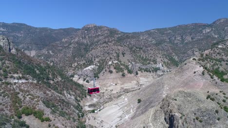 Aerial-shot-of-a-cable-car-in-the-Urique-Canyon-in-Divisadero,-Copper-Canyon-Region,-Chihuahua