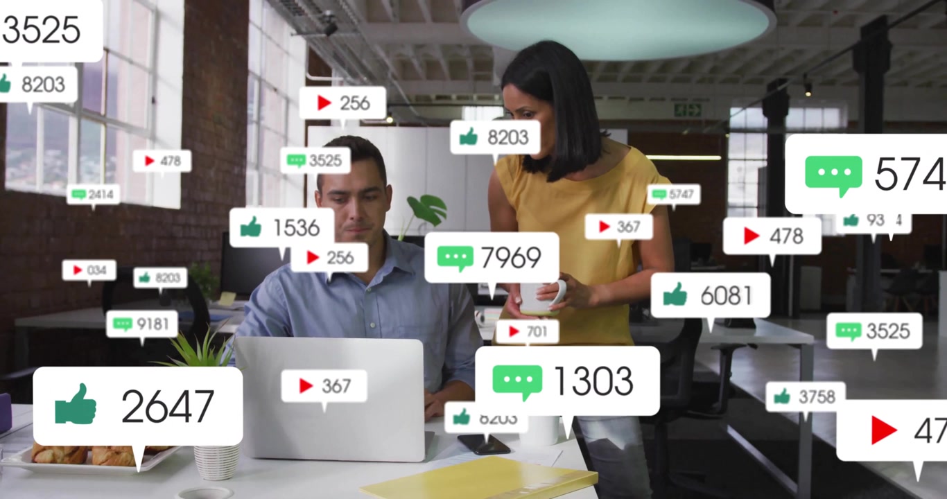 Man typing laptop triggers animating social media icons showing rising engagement metrics at desk