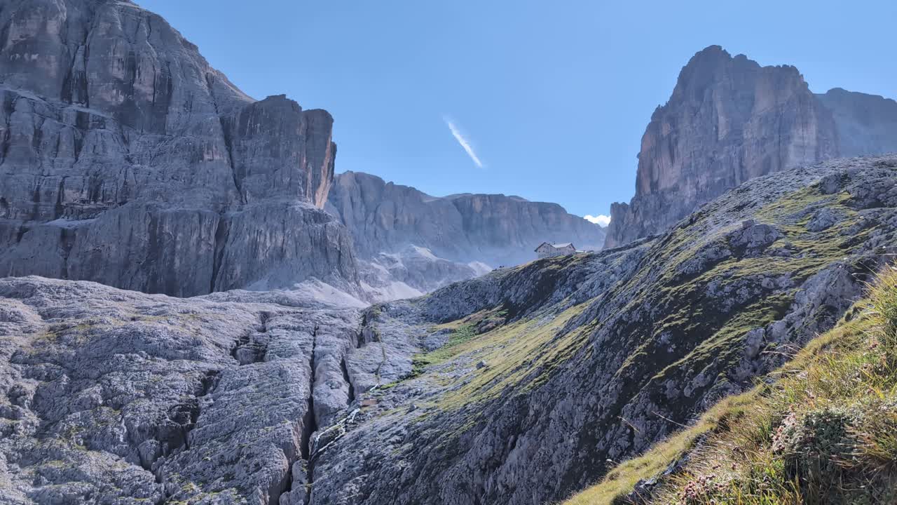 Mountain hut on the peak in Dolomites, Cavazza Pisciadu mountain rifugio