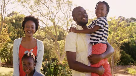 Portrait-of-cute-family-is-playing-in-the-park-