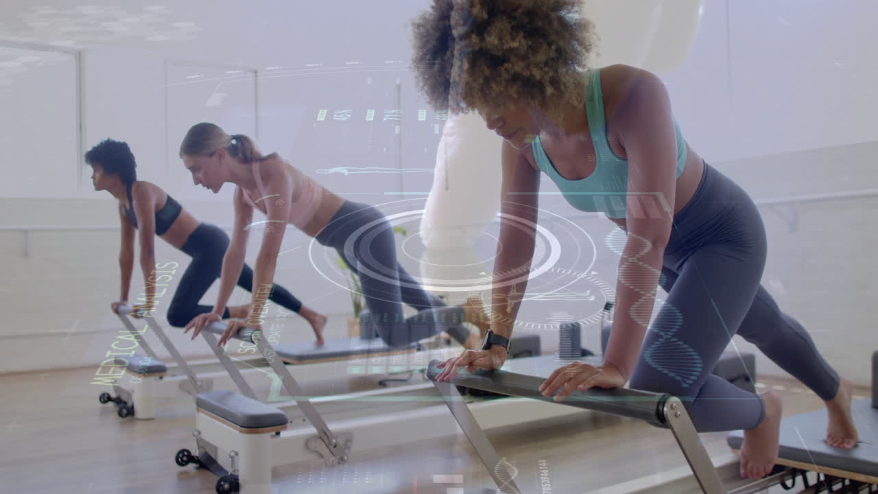 Women exercising on reformer machines with digital data overlay animation