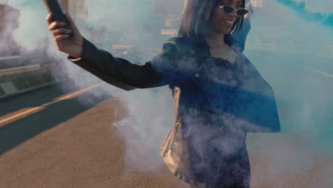 girl dancing with blue smoke grenade in city young rebellious woman celebrating creative expression with dance in street slow motion