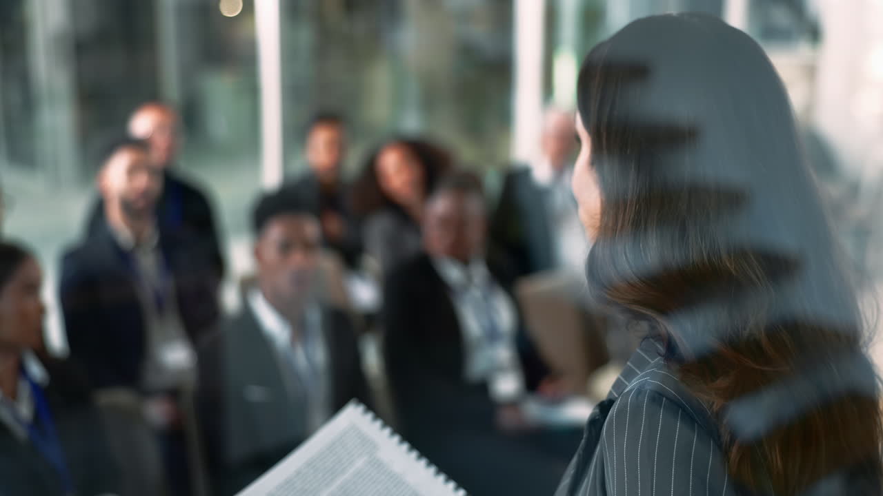 Businesswoman Giving a Presentation to a Group of People