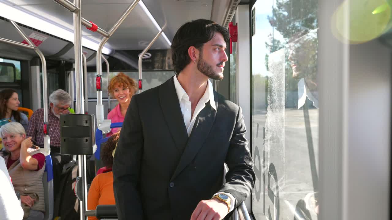 Man riding a bus looking out the window