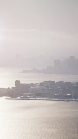 aerial view of a city skyline with fog