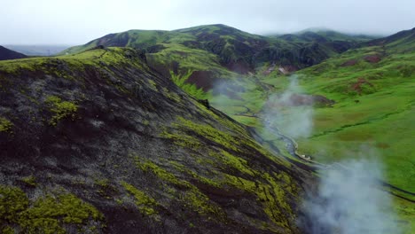 steam coming from the smoke river valley of reykjadalur in south iceland