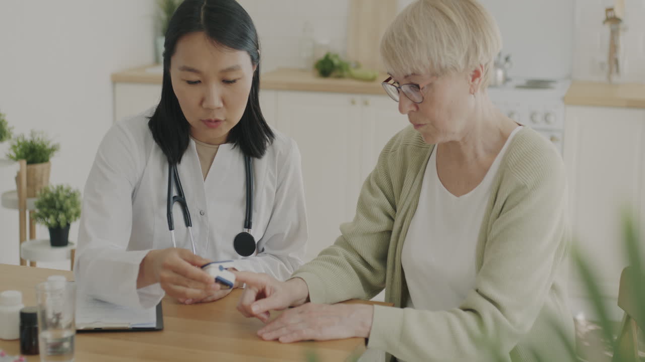 Doctor examining patient's blood sugar level