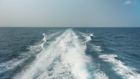 view from stern of high speed ferry of a turbulent water trail on the surface of the ocean