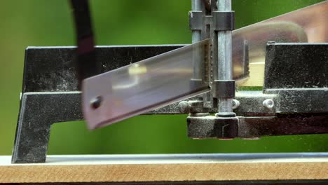 cutting a picture frame moulding with a miter saw