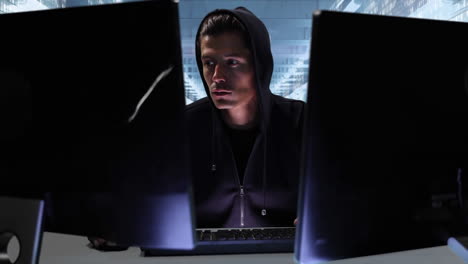 Animation of hooded man hacking a computer