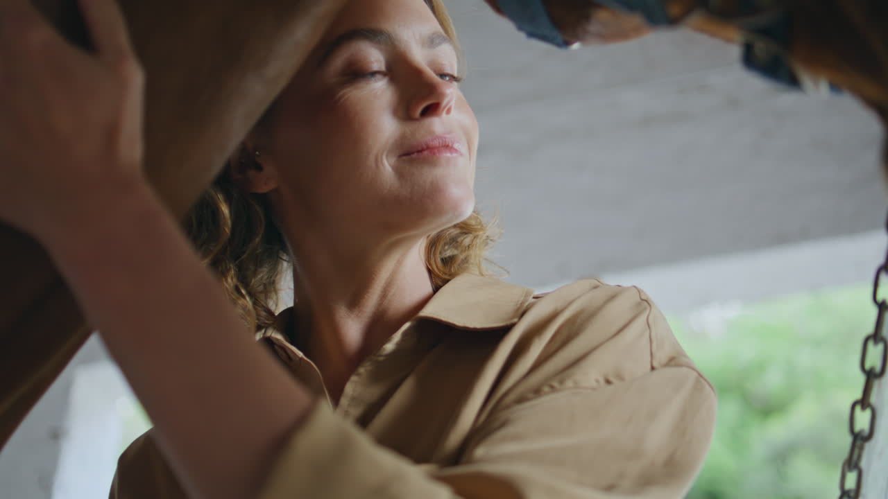 Caring equestrienne petting horse at cozy paddock closeup. Woman touching animal