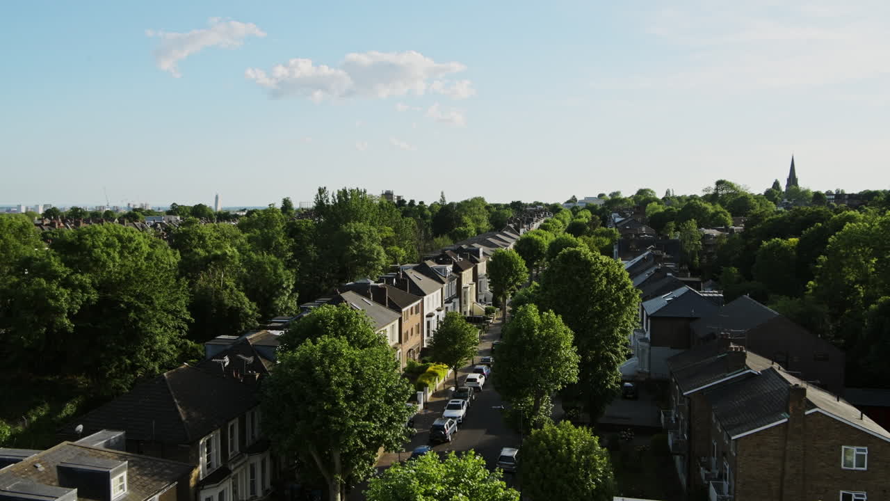 Scenic View Of Houses And Green Trees At The Residential Terraced Housing In Central North London, United Kingdom - aerial panning shot