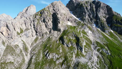 aerial-closeup-of-dolomites-mountain-range-peaks-in-the-Italian-Alps-on-a-sunny-summer-day