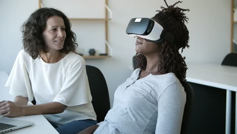 Smiling-women-testing-VR-headset