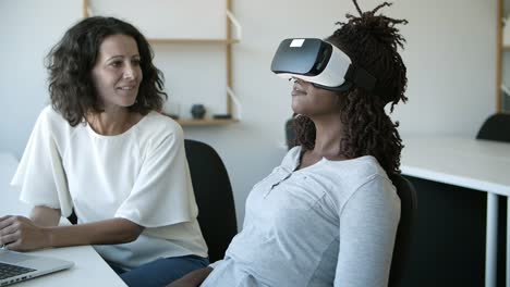 smiling women testing vr headset