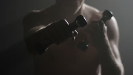 man working out with dumbbells