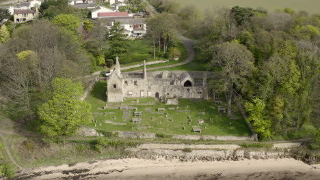 an aerial view of st bridgets kirk ruin on the banks of the firth of forth, scotland