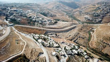 aerial footage over east jerusalem palestinian neighborhoods with security fence