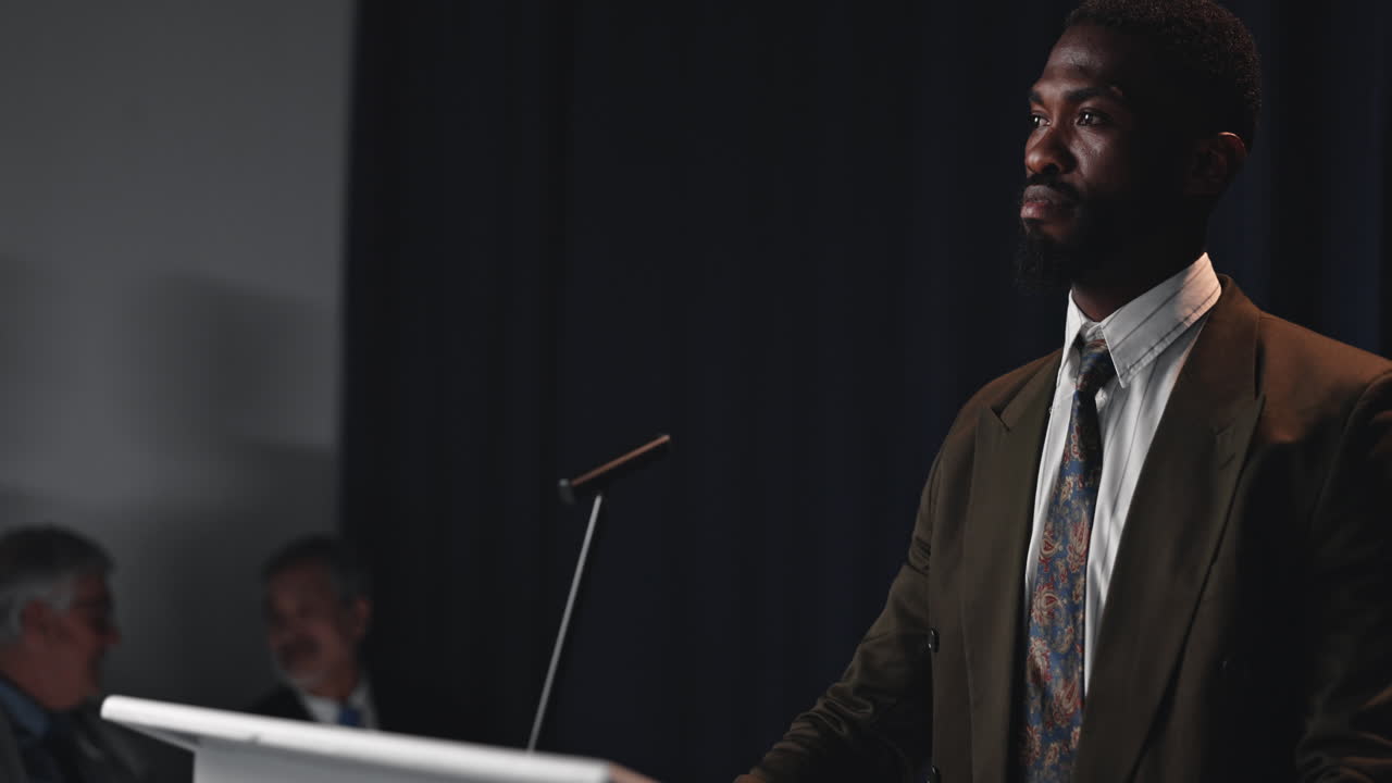 Man giving a presentation at a conference