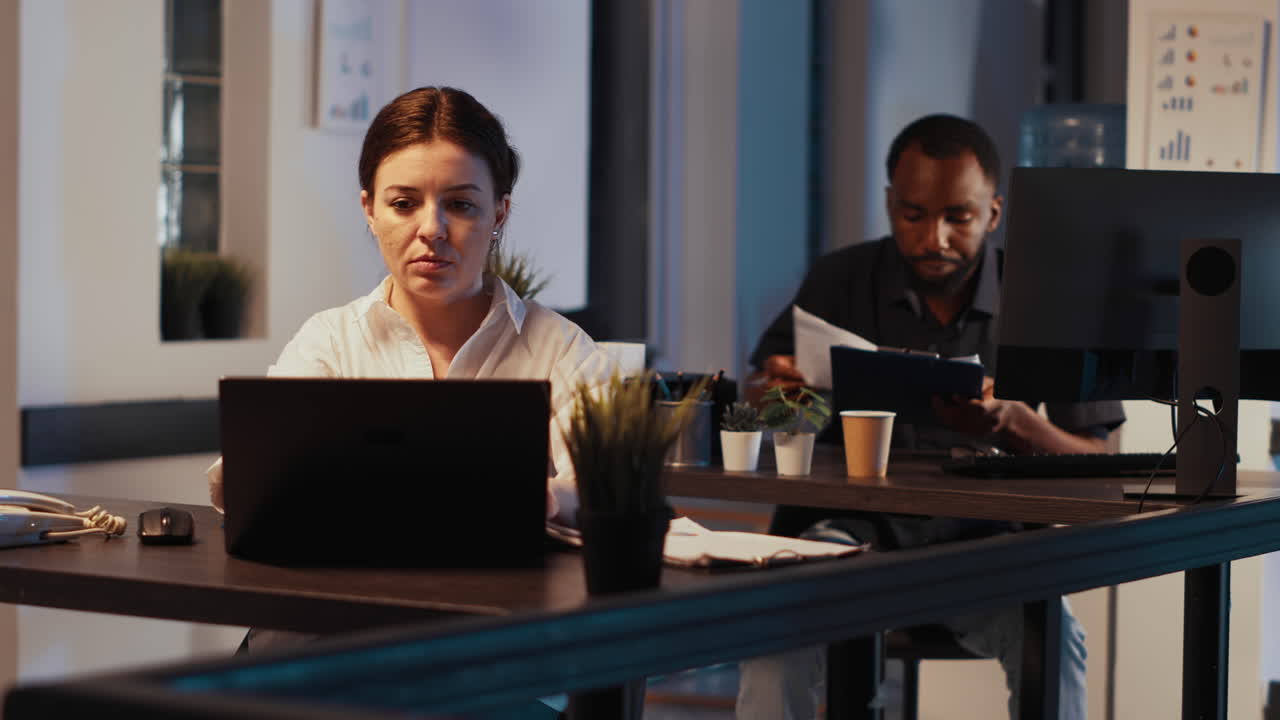 Young adult using landline phone to have remote conversation