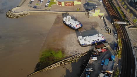 aerial view of a hovercraft turning and leaving the ryde hoverport, isle of wight, uk