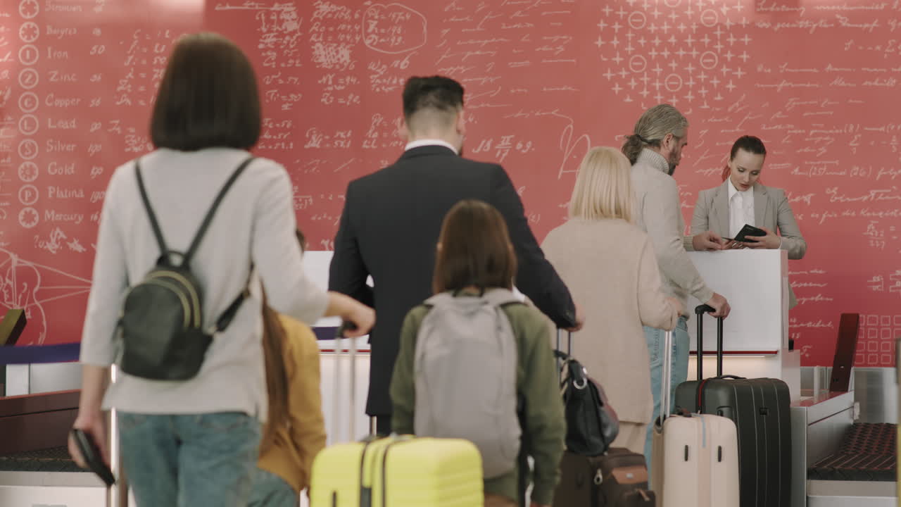 Passengers Waiting In Queue At Check-In
