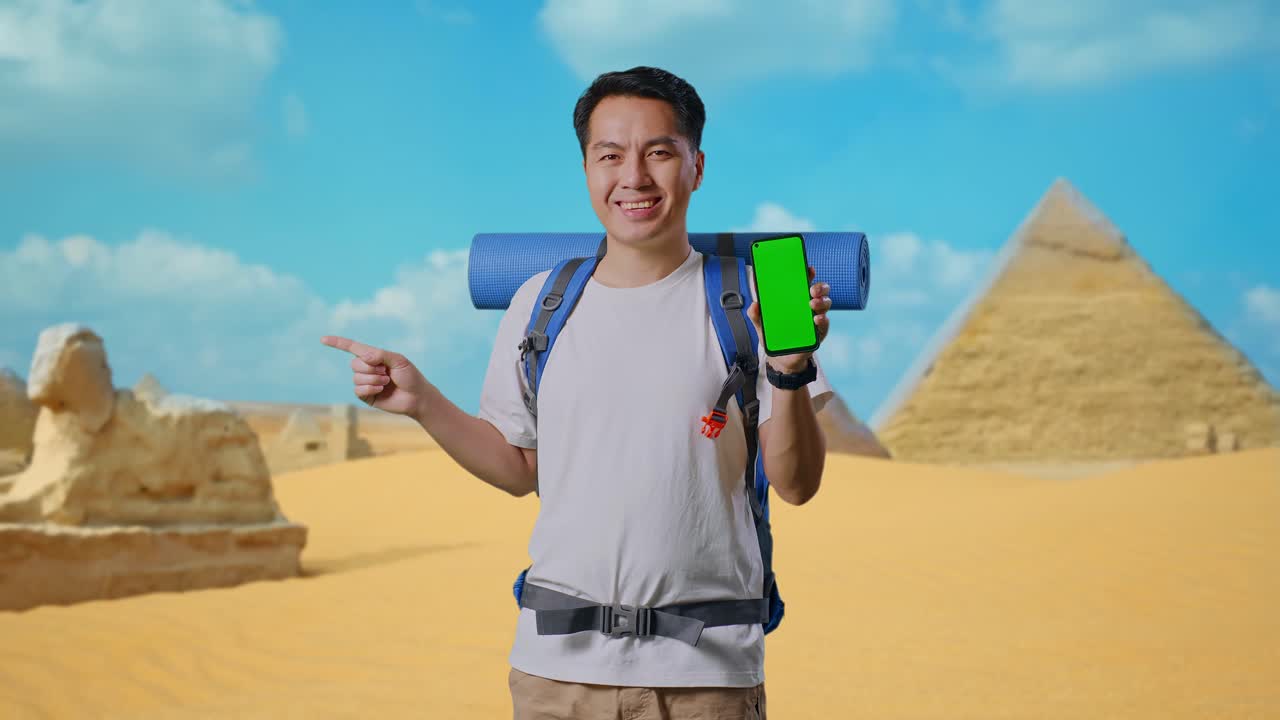 Smiling Tourist with Green Screen Phone in Front of Pyramids