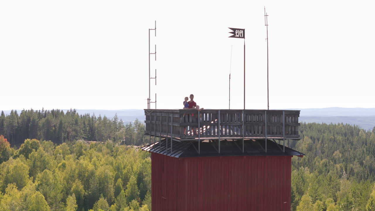 Father and kids atop Intrånget mine shaft tower, Garpenberg, Dalarna. Aerial arc