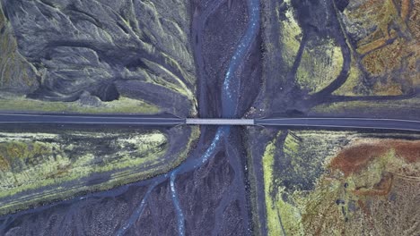 top down view of bridge with vehicles traveling in south iceland - aerial drone shot