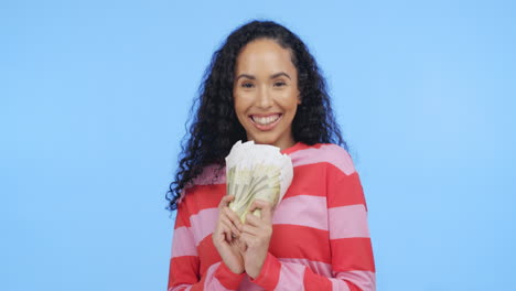 portrait of excited black woman with money