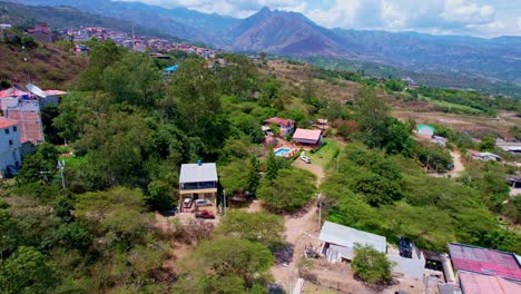 Aerial-view-of-a-sunny-day-in-the-mountains-with-blue-pools-in-the-middle-of-big-trees-with-outstanding-colors-in-the-middle-of-summer-with-the-blue-sky-in-the-middle-of-green-nature