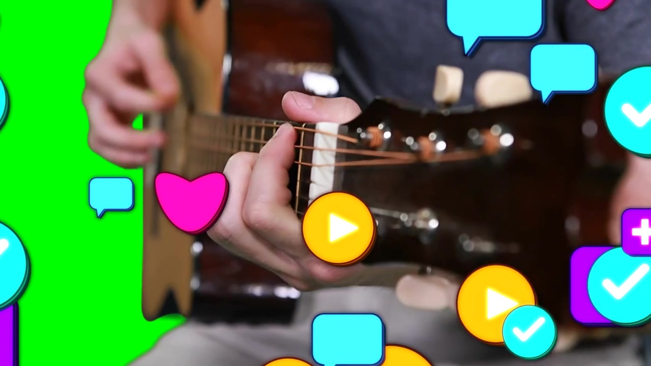 Male guitarist fretting and strumming in music recording, causing app icons rising across frame