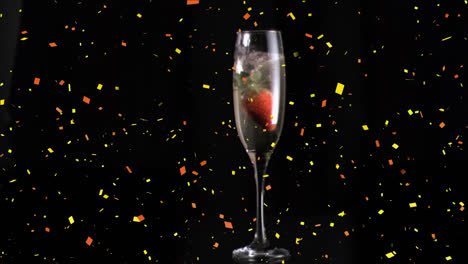 Animation-of-confetti-over-glass-of-champagne