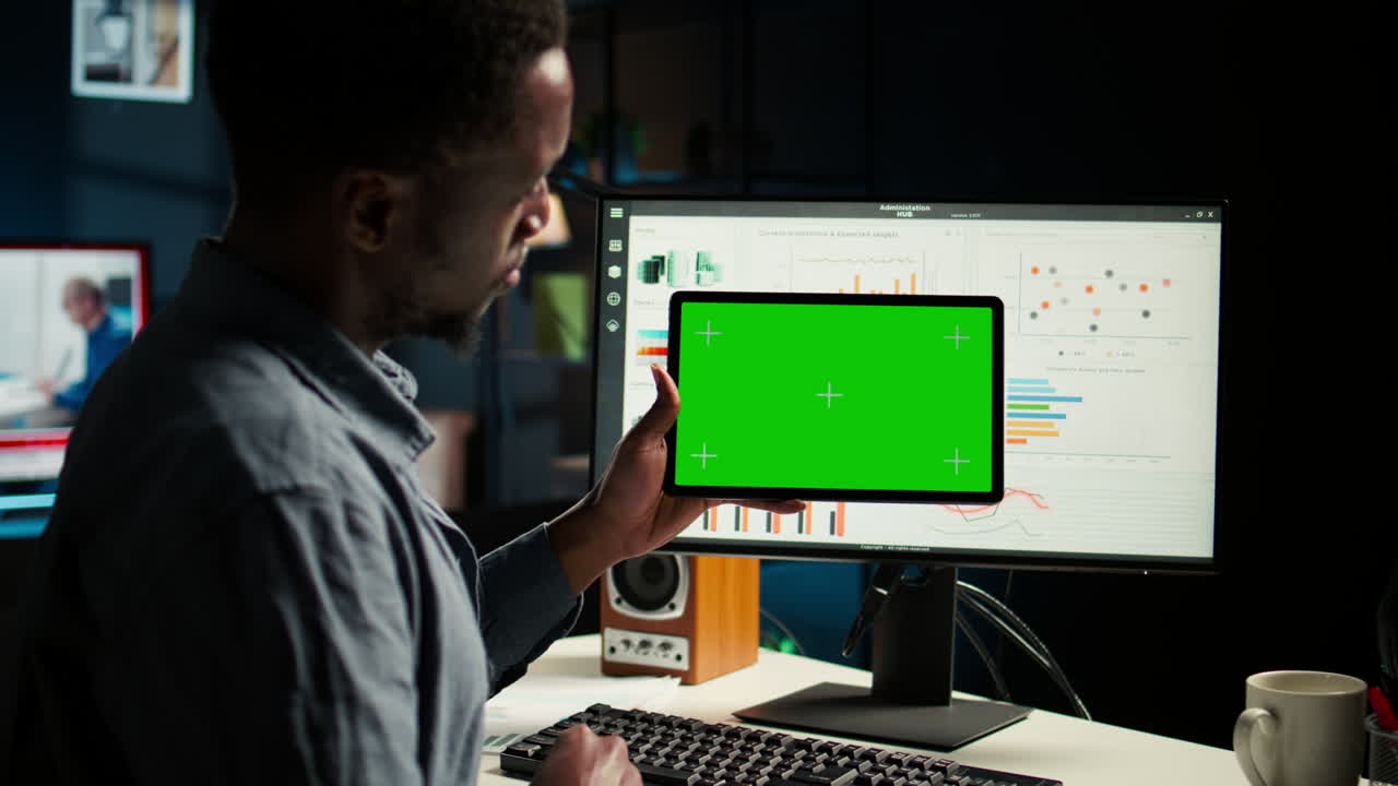 Male specialist reviewing financial elements next to copy space display