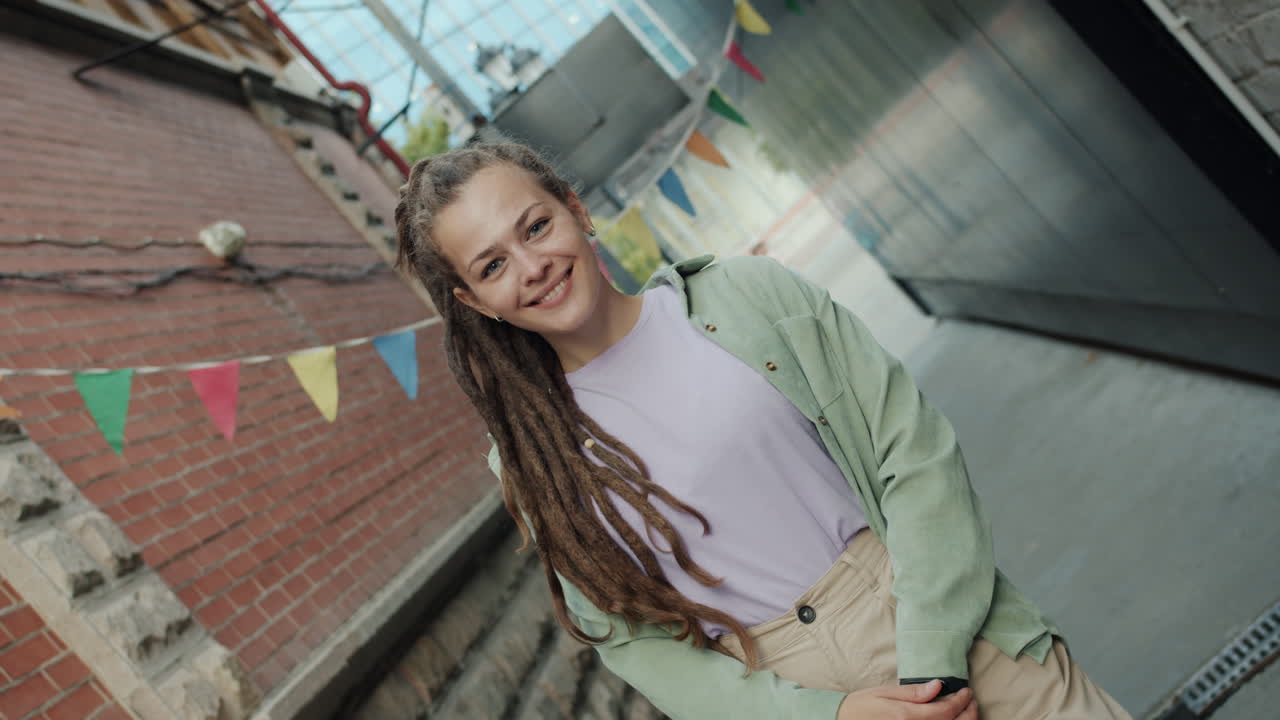 Woman with Dreadlocks in Urban Setting