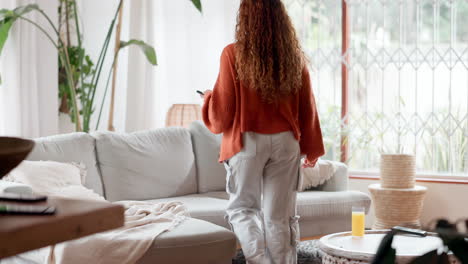 woman relaxing on sofa at home