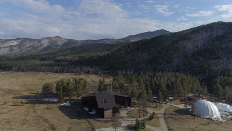 flight over hotel in siberian mountains