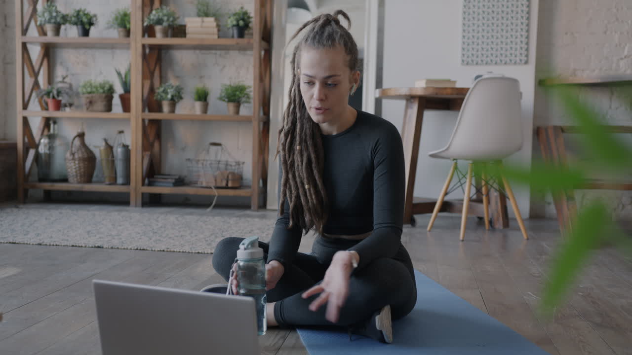 Woman taking a break during a fitness class